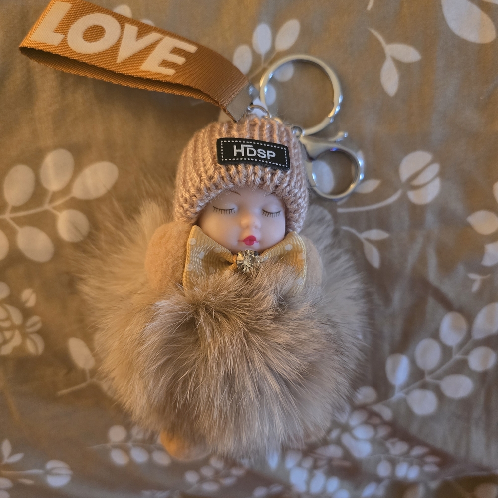 Beige and Brown Sleeping Baby Key Holder